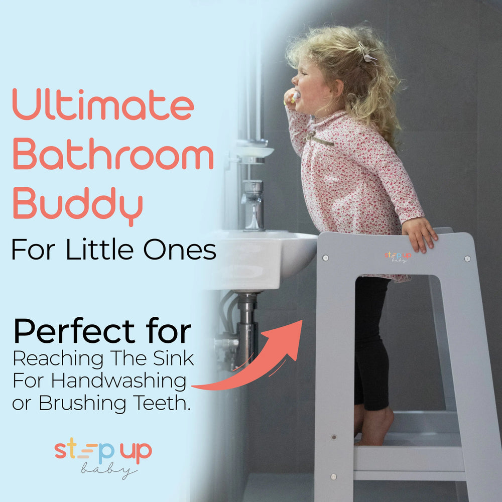 grey toddler tower positioned at bathroom sink for easier reach